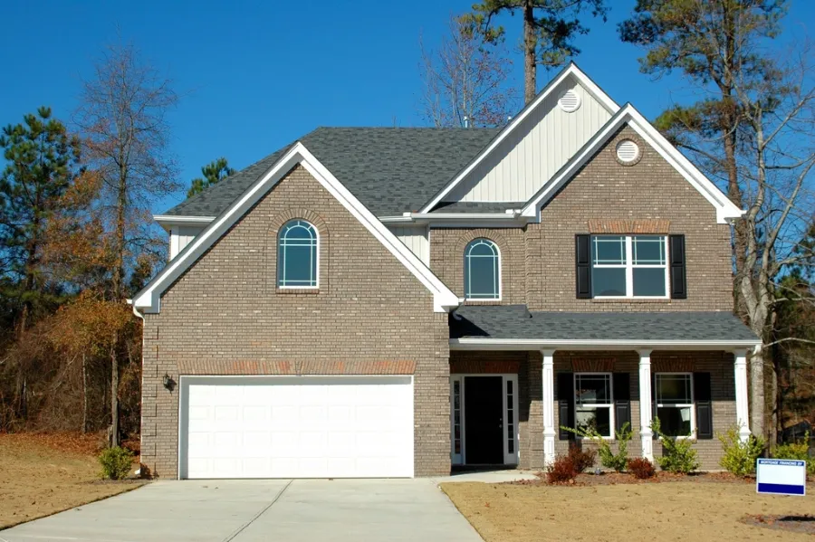 Two-story family room addition matched to the existing roofline