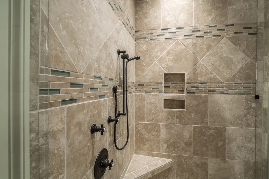 Tub converted to a tiled walk-in shower with a glass panel