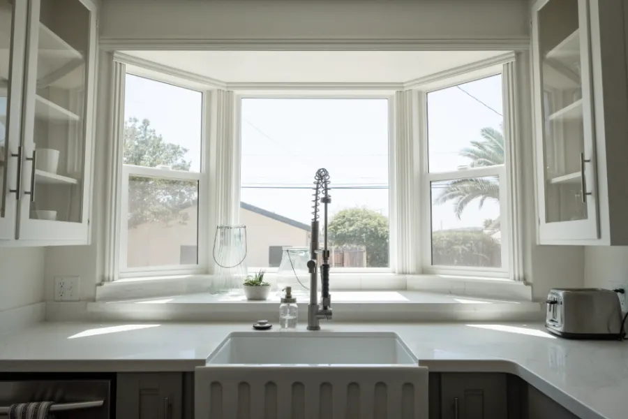Full kitchen remodel with custom cabinetry and quartz counters