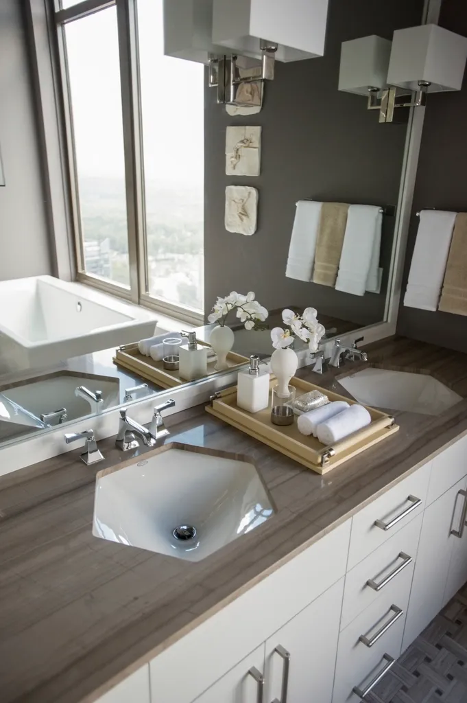 A remodeled bathroom with a tiled walk-in shower